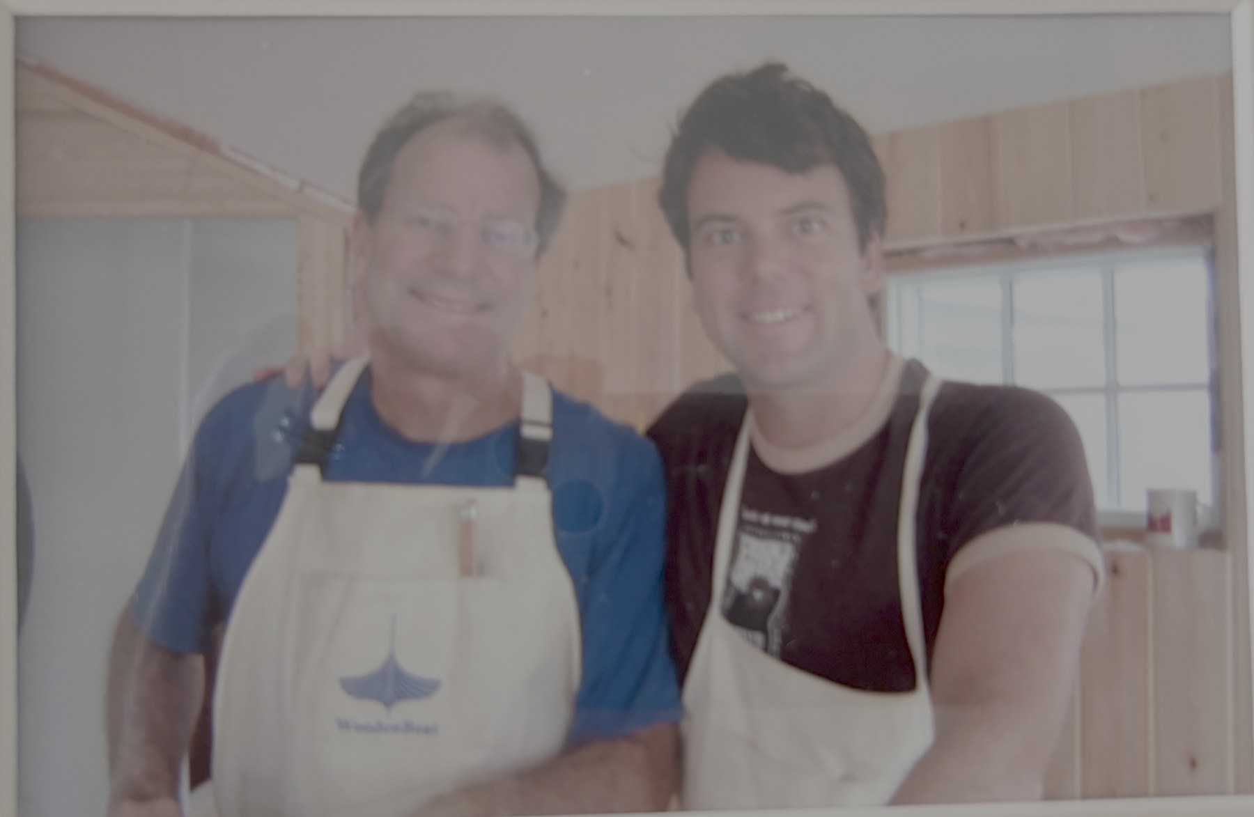 Chris and his father in work aprons inside the Stay Close cottage during the build