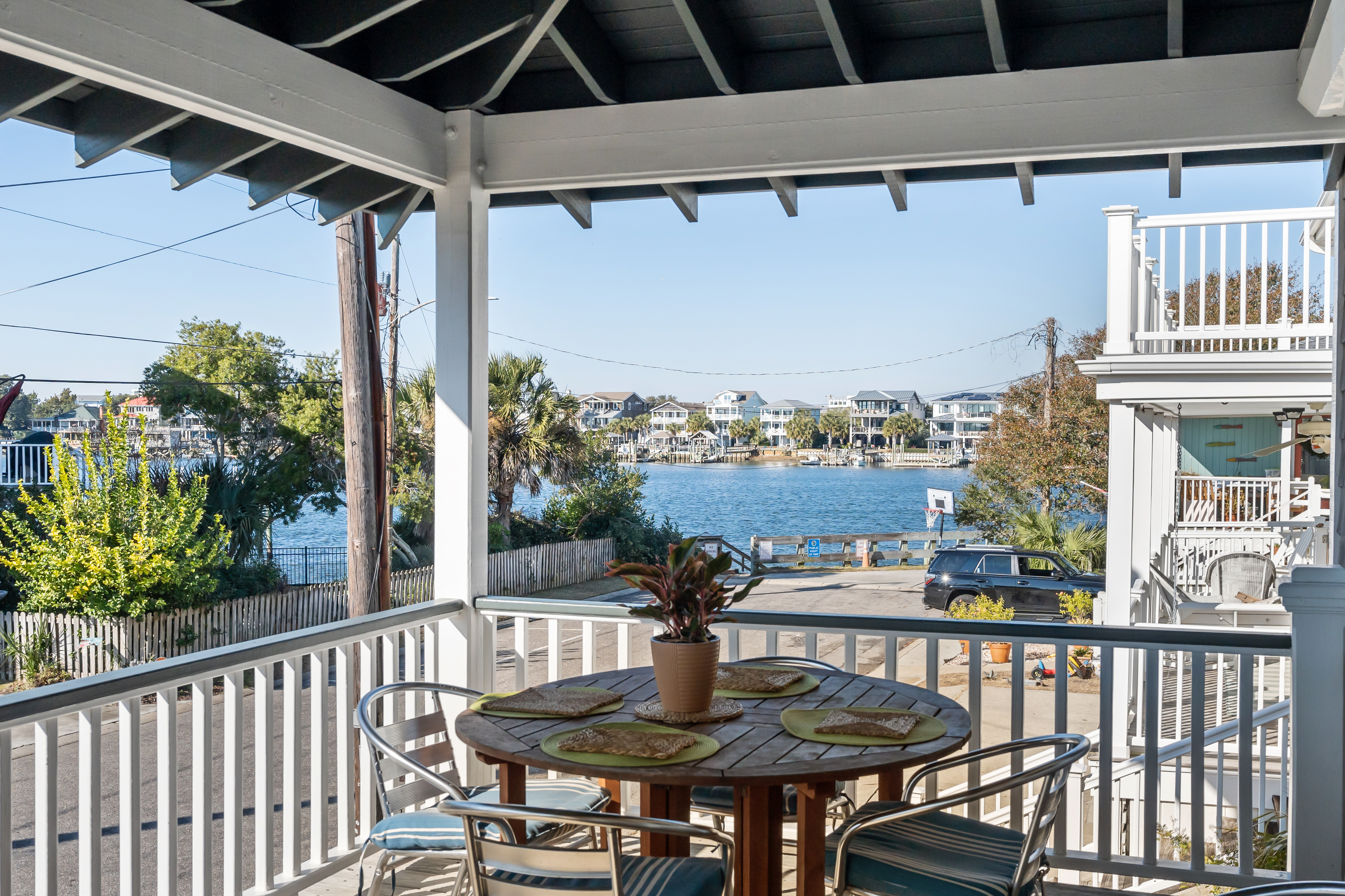 The covered porch at Stay Close looking out toward the water