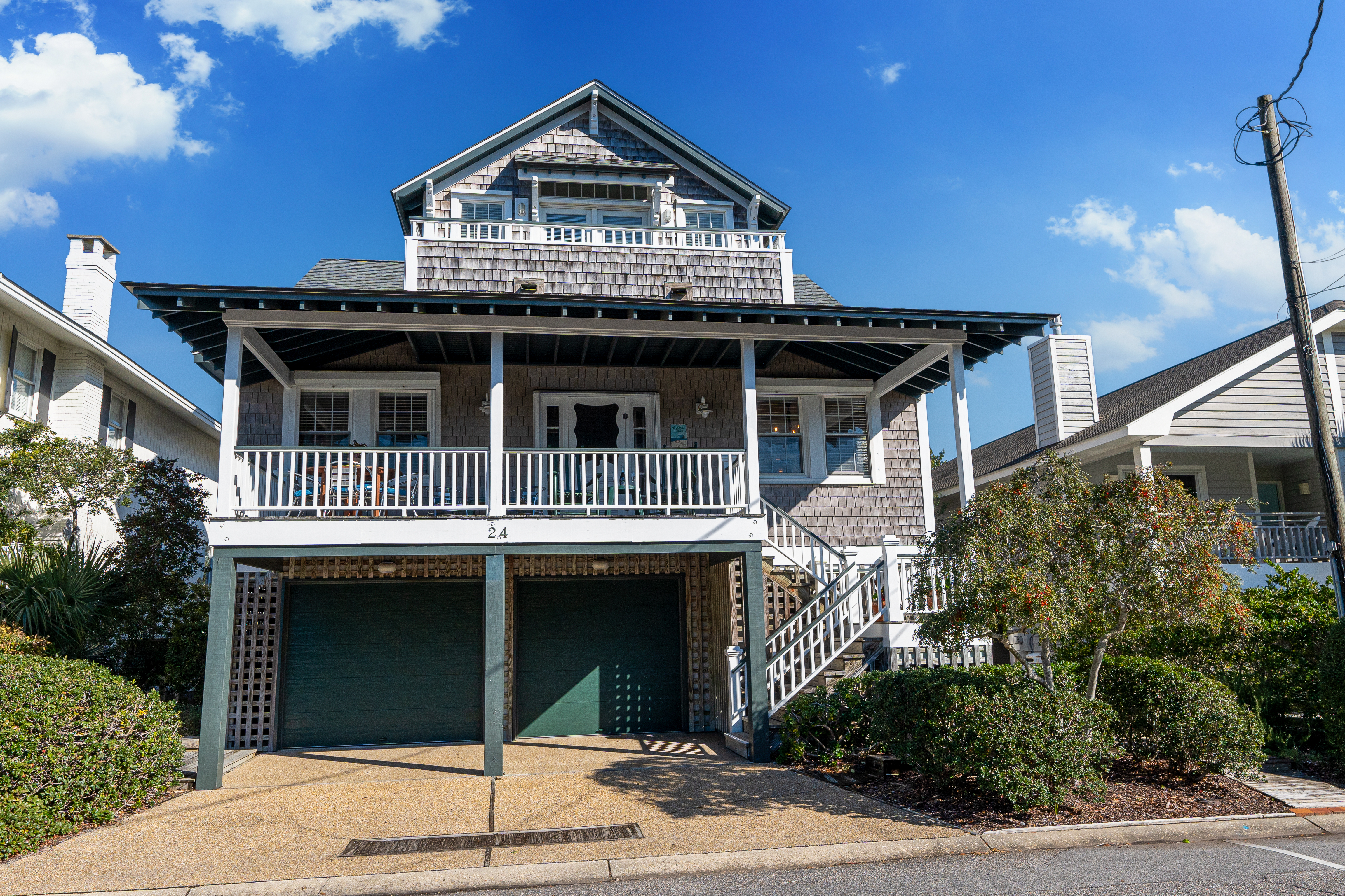 The cedar-shingled Stay Close cottage with its deep front porch